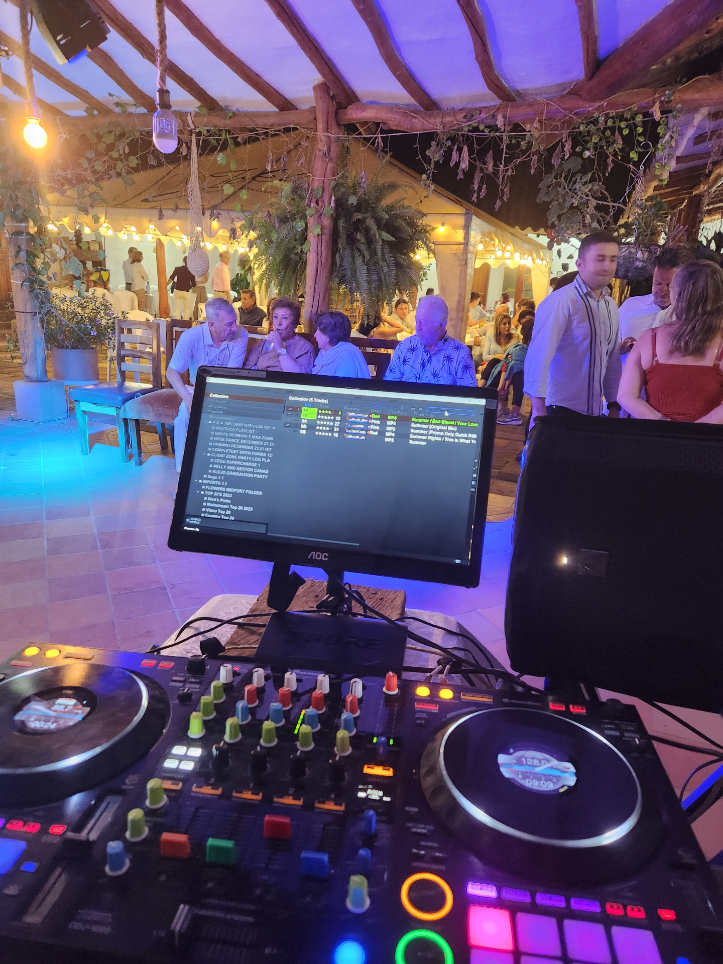 Birthday celebration DJ setup with guests